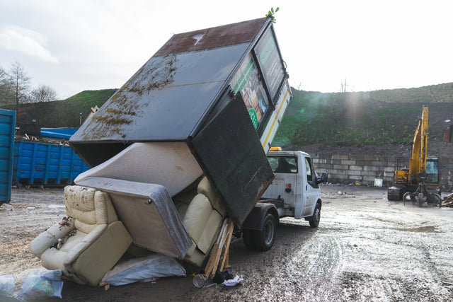 Senior Waste Removals crew loading waste during a house clearance in Salford