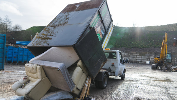 Senior Waste Removals crew loading waste during a house clearance in Salford