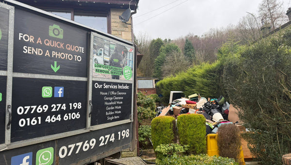 Senior Waste Removals team loading a van during a clearance