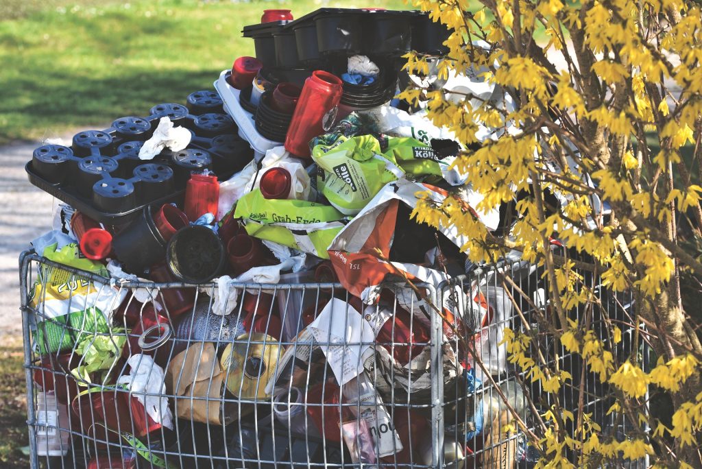 A metal basket filled with lots of bottles